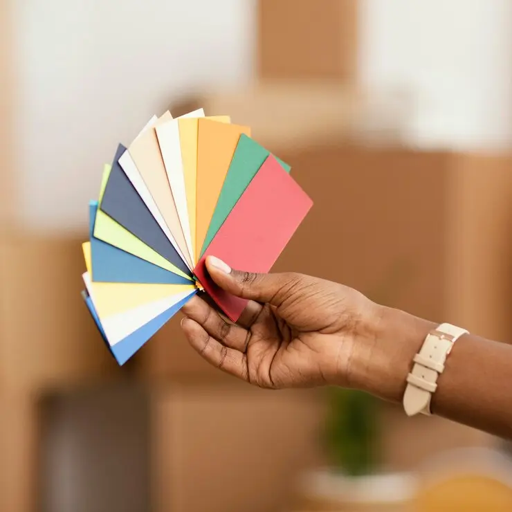 Woman making home renovation plans with color palette